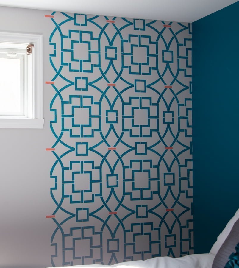 Stencilling a wall with a stencil from Cutting Edge Stencil. This geometric pattern will look great for an accent wall in my master bedroom. I even used 2 colors for the Tea House Trellis Allover Stencil. You can find out if stencilling is for you or not! Stencil will bleed and it won't be perfect. See why. #cuttingedge #stencil #diy #masterbedroom #makeover