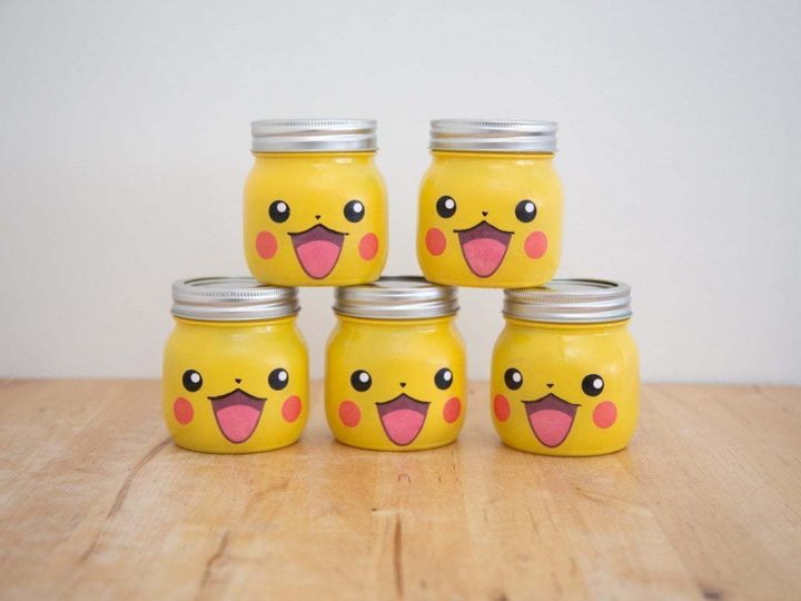 The final result of the DIY Pikachu Mason Jar gifts. 5 jars mounted in a pyramid (3 at the bottom and 2 on top)