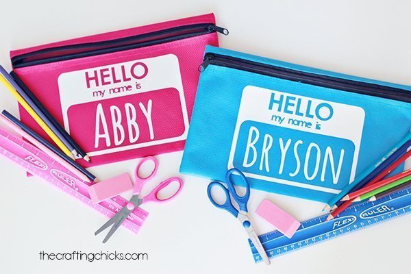 Make school labels: Two pencil case. The pink says Hello, my name is Abby and the blue says Hello my name is Bryson