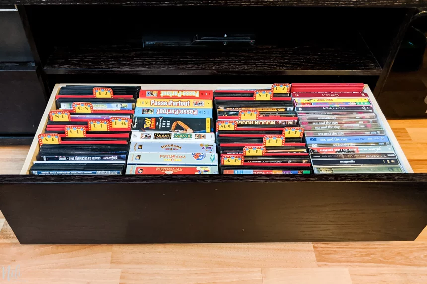 A view of the drawers where the DVDs are organized using the tab dividers for better organization