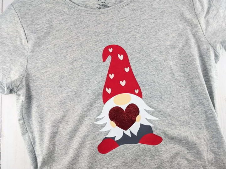 layered Iron-on vinyl of a Valentine's day gnome on a grey t-shirt