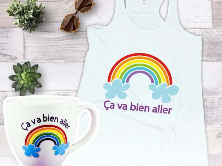 Tank top and mug, both with rainbows that were made to show how to layer vinyl with your Cricut