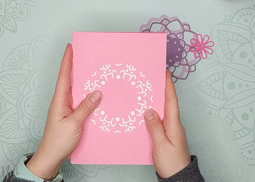 assemble the white cardstock to make the 3D layered mandalas made with the free SVG files