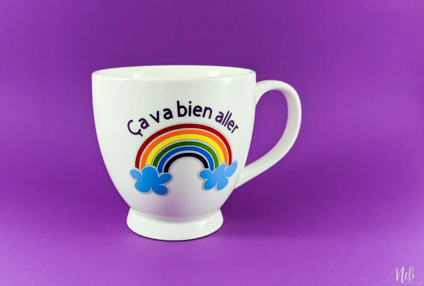 Rainbow mug made to show how to layer vinyl with your Cricut