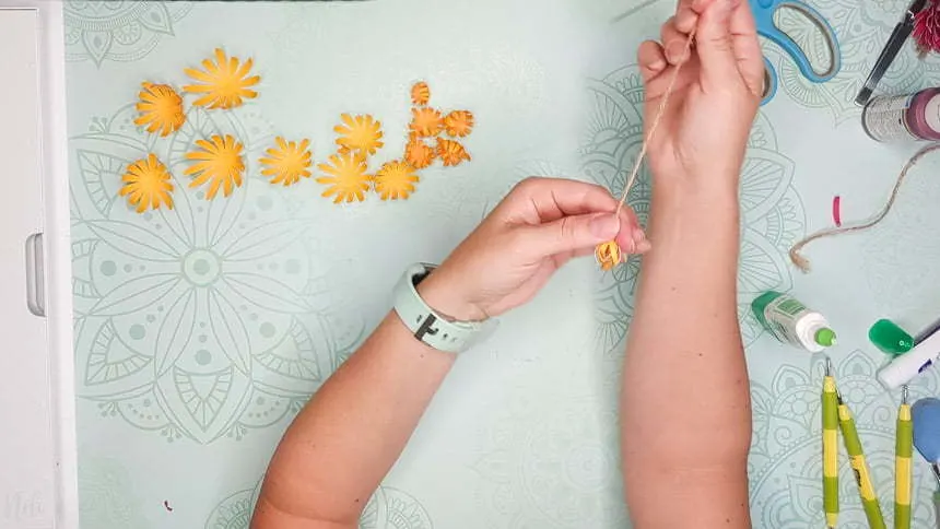 Pulling gently on the petals to make the DIY paper Chrysanthemum