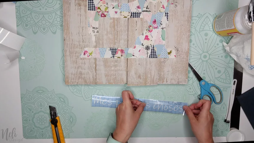 Use a stencil in the Cricut to make the frame text with the fabric scraps.