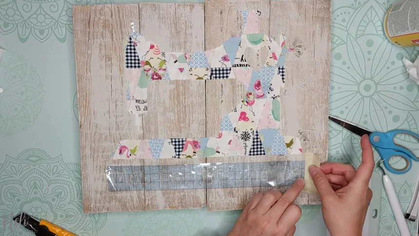 Gently remove the paper transfer from the frame with the fabric scraps