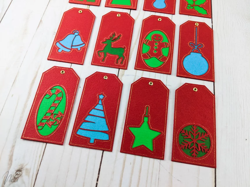 12 Christmas tags made with Cricut Foil tip